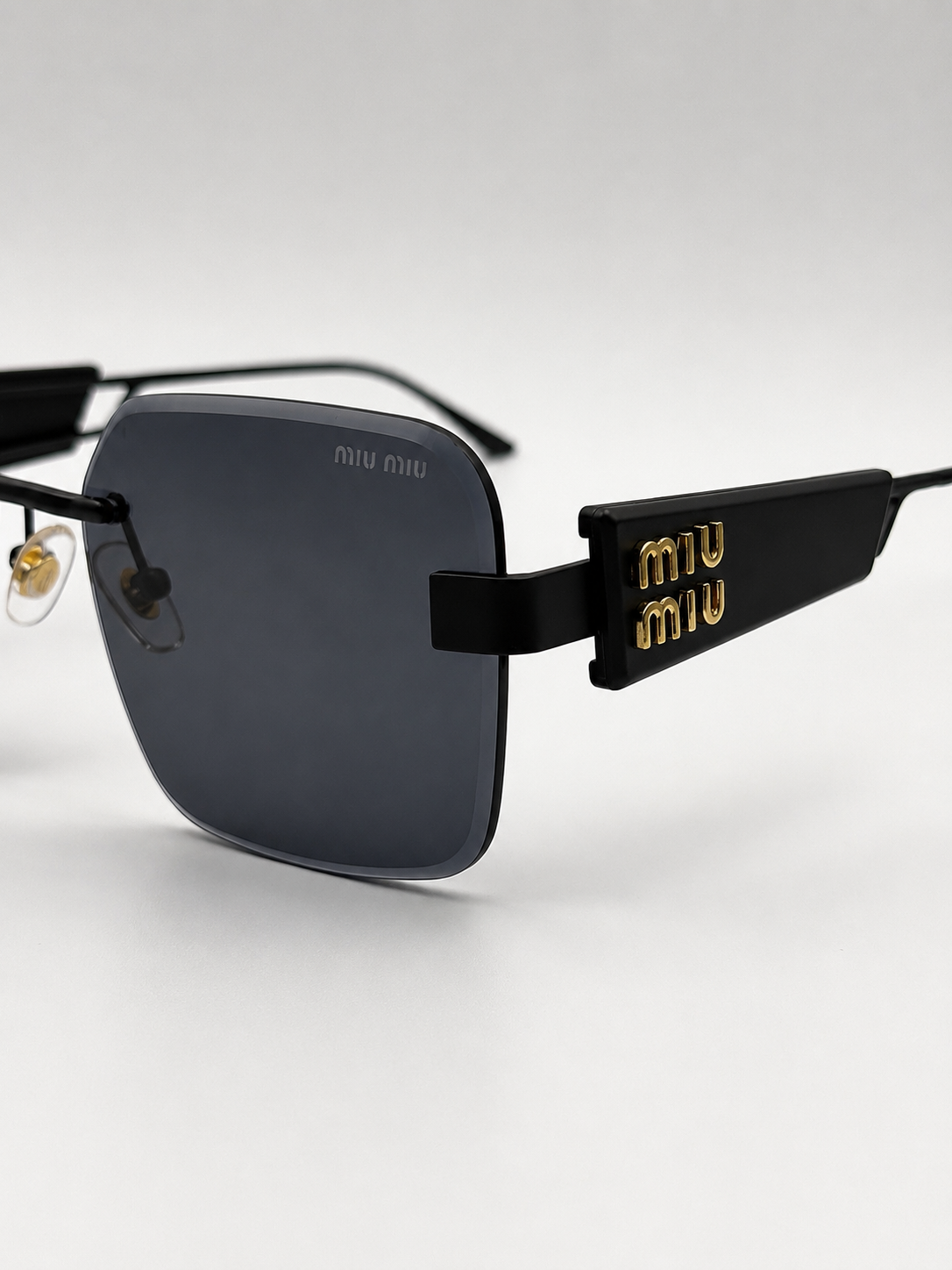MiuMiu Black Gold